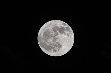 moon and airplane at night