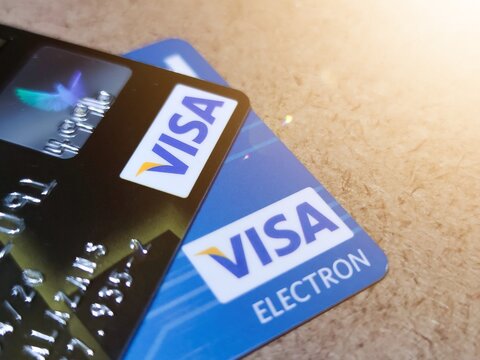 Close-up of Visa credit cards placed on a wood background