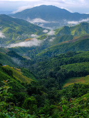 The beauty of green mountains during the rainy season in Nan Province, Thailand.