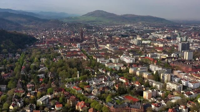 Drone shot, drone photo, drone flight, of the old town, city centre Freiburg im Breisgau with view of the cathedral and mountains, morning light, Neuburg, Baden-Wuerttemberg, Germany, Europe
