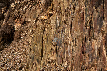 The texture of rocks in the sun. The stone structure of the rock