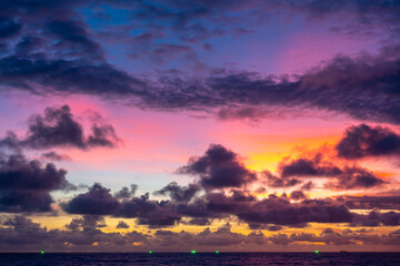 Landscape colorful clouds in the sky sunset or sunrise over sea with reflection in the tropical sea,Beautiful landscape scenery,Amazing light of nature, Landscape nature background