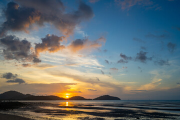Fototapeta premium Landscape colorful clouds in the sky sunset or sunrise over sea with reflection in the tropical sea,Beautiful landscape scenery,Amazing light of nature, Landscape nature background