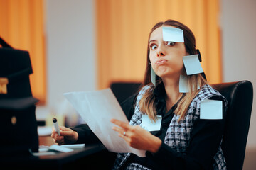 Busy Businesswoman Being Covered in Sticky Notes Working. Stressed office worker using written...