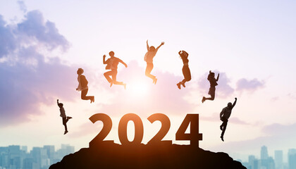 Group of jumping multinational people. 2024 New Year concept. New year's card 2024. Wide angle...