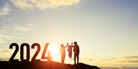 Silhouette of walking family. 2024 New Year concept. New year's card 2024. Wide angle visual for...