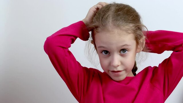 A little toothless girl smiles. Close-up. Isolated background