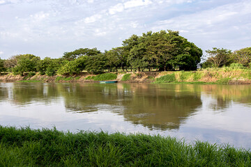 Fototapeta premium Beautiful rural view of an arm of the Magdalena River in the city of Mompox, Colombia.