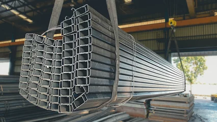 Deurstickers Light mouth steel channel or C channel steel for construction materials. C-shaped steel structure. Construction of a factory house building. © thongdee