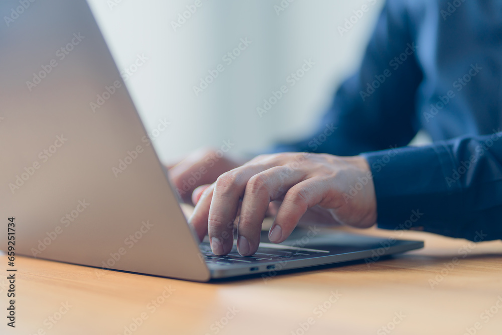 Poster man entrepreneur use laptop computer working at home. male hands typing on the laptop keyboard. busi