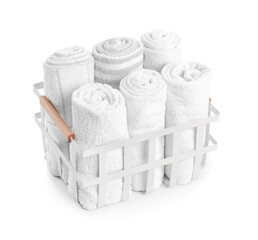 Basket with rolled towels isolated on white background