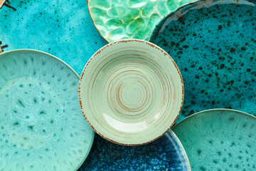 Closeup view of turquoise ceramic plates as background