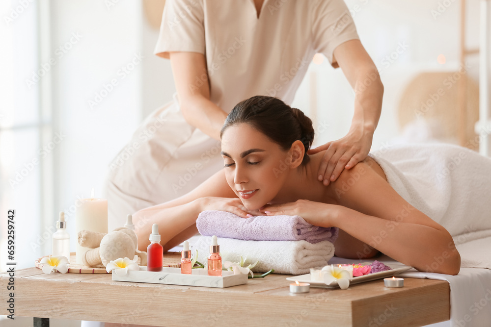 Canvas Prints Young woman getting massage in spa salon, closeup