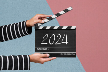 Film crew holding a clapperboard or film slate For filming the new story in year 2024. - obrazy, fototapety, plakaty