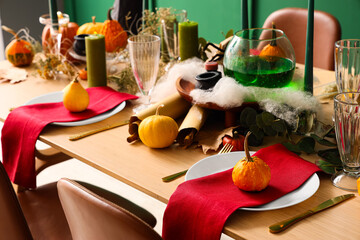 Festive table setting with pumpkins for Halloween party, closeup