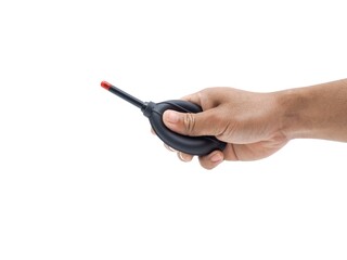 Male hands holding cleaning equipment for camera and computer lens.  Black blower with red tip for blowing dust.  Set isolated on white background.
