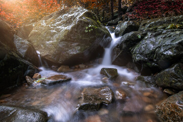 Beautiful colorful natural waterfall rainforest feel freshness breath on autumn season holidays.