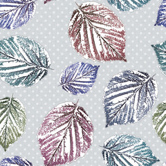 Seamless colorful autumn pattern with leaves. Blue, green, brown leaves on a gray background with white polka dots.