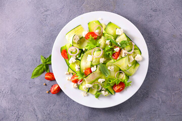 fresh zucchini salad with tomato and feta cheese- healthy eating