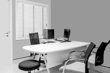 Stylish workspace with computer and bookshelves. office desk con