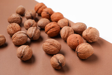 Whole walnuts on color background
