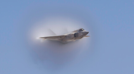 Fighter Jet with fog on the wing