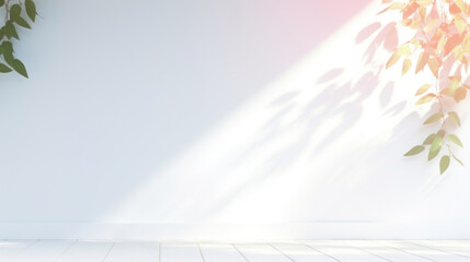 White wall with soft pastel shadows of leaves
