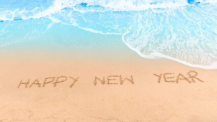 New Year 2024 concept. Happy new year on brown sand and blue ocean waves. Top view.Investment in...