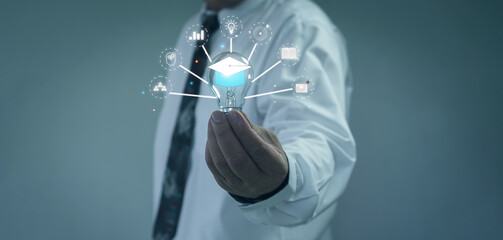 E-Learning Postgraduate Diploma Program Concepts. hand holding light bulb showing graduation cap internet education creative and Study work knowledge and business ai, problem solving, brainstorming.