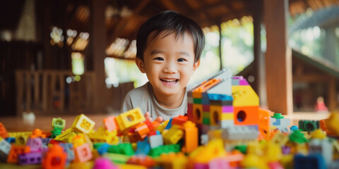 Fototapeta na wymiar Portrait of a cute smiling boy with toys