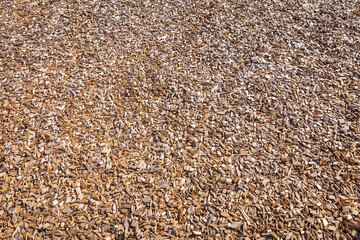 Woodchips used as safe soft surface for a playground or against weeds in a garden