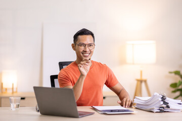 Happy business man work on laptop for email update, online project and reading digital report with mockup space. freelance asian man  entrepreneur and working from home research, planning and info 