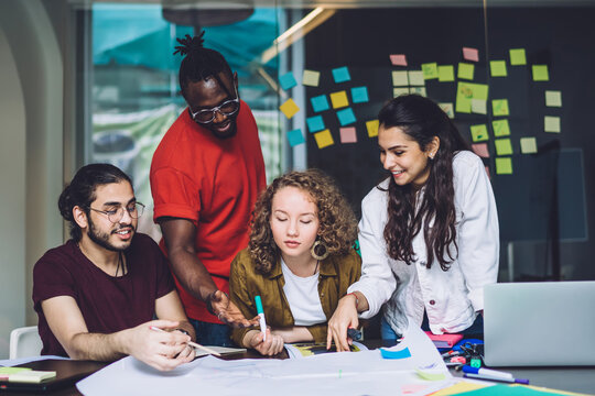 Coworking young students at desk