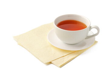 Cup of tea and paper napkin on white background