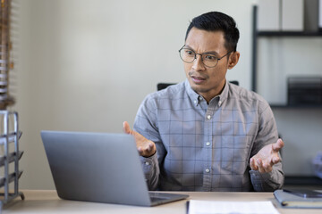 Portrait of Stylish Asian Businessman Works on Laptop, Does Data Analysis and Creative Designer, Looks at Camera and Smiles. Digital Entrepreneur Works on e-Commerce Startup Project