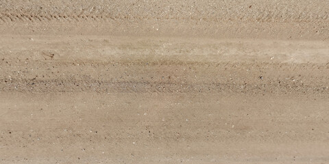 panorama of road from above on surface of gravel road with car tire tracks in countryside - obrazy, fototapety, plakaty