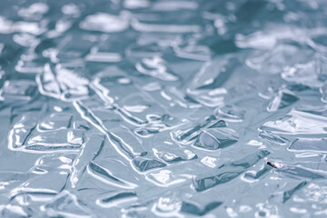 Cold water and ice cubes melting background. Global warming or climate change concept. Cold...