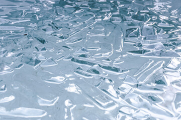 Cold water and ice cubes melting background. Global warming or climate change concept. Cold...