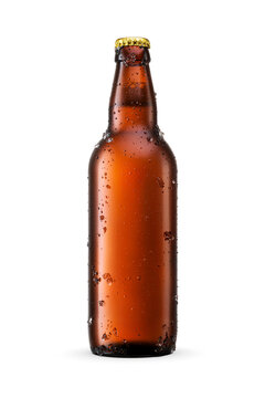 Beer in amber glass bottle with water droplets and ice crystals isolated. Transparent PNG image.