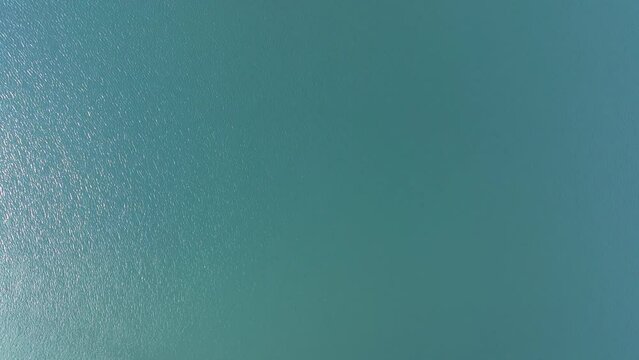Overhead View Of Calm Blue Waters On A Sunny Day. - aerial