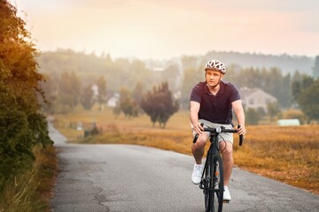 Obraz premium Exploring nature. Into the Wilderness. The biker rides a bicycle.