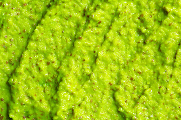 Smoothie with fresh green vegetables and fruits. Berry and yogurt ice cream. The texture of the sorbet. Delicious sweet dessert close-up as a background.