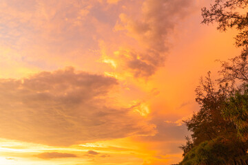 .Amazing colorful yellow cloud of sunset over the ocean. .golden cloud moving in stunning sky. .beautiful yellow sunset landscape amazing light of nature sky over horizon. .sunset landscape background