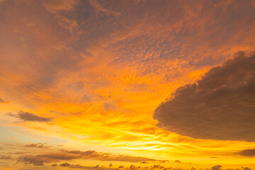 .Amazing colorful yellow cloud of sunset over the ocean. .golden cloud moving in stunning sky....