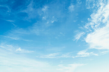 Blue sky with white clouds float in the sky on clear day with warm sunshine combined with cool...