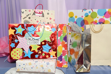 Colorful shopping bags on a table.Bags with gifts