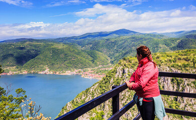 Fototapeta na wymiar Danube river scenic view, woman hiker at viewpoint.