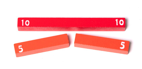 Fototapeta premium Wooden counting rods used to calculate mathematics using colour and shape in early school books