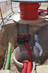 construction workes installing hdpe corrugated pipe with double wall strength at the construction...