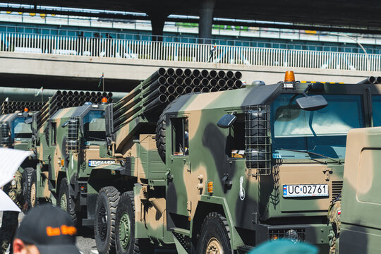 08.16.2023 Warsaw, Poland. Several HIMARS vehicles in the open air. Military parade showing off High Mobility Artillery Rocket System vehicles. High quality photo